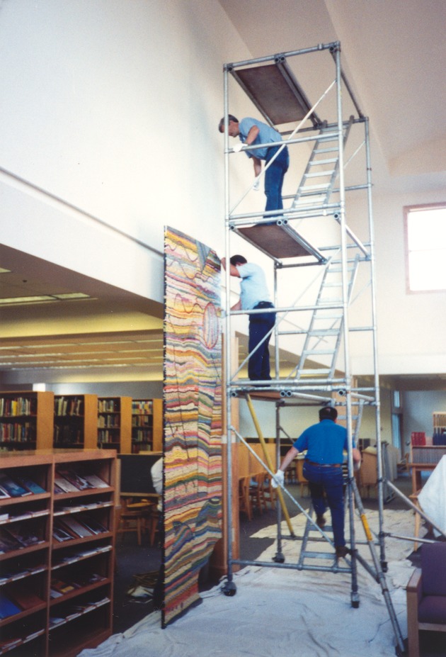 [Raising one panel of Mason mural to position on south wall, Kirk Library]
