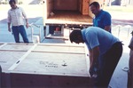 [Mural in crate being unloaded in front of the Library]