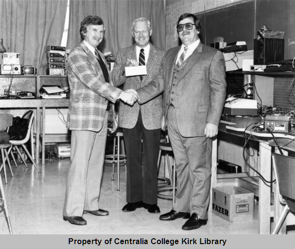 Bob O'Neill Presenting a Check to College President Jerry Young