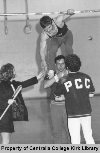 Norm Steelhammer goes up on bars - Men's Gymnastics