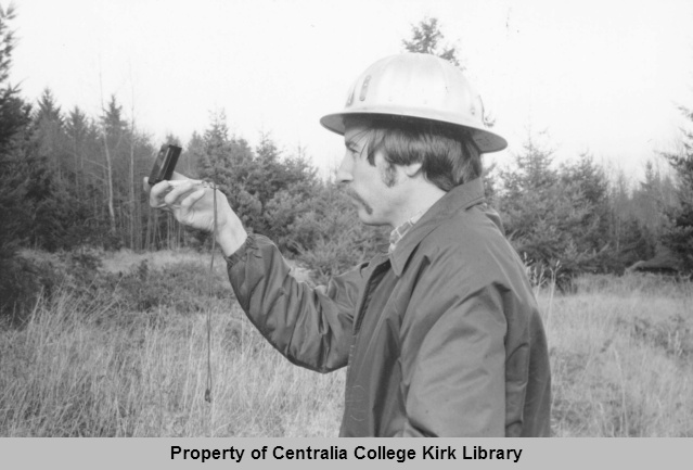 Forestry Technology Student Using A Compass